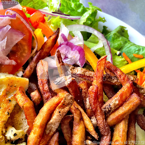 Image of French fries and salad
