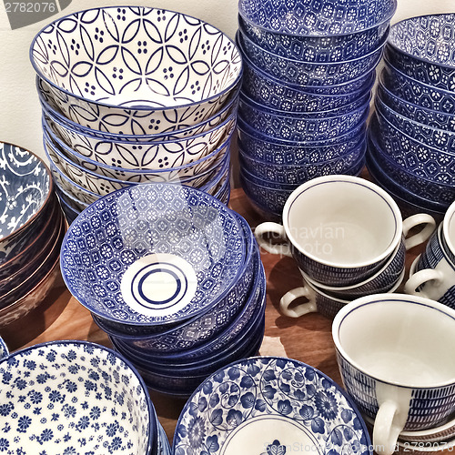 Image of Blue ceramic plates and cups