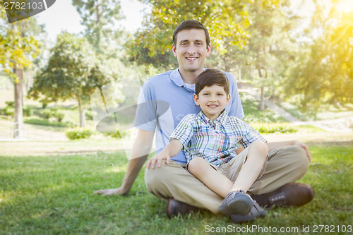 Image of Handsome Mixed Race Father and Son Park Portrait