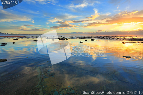 Image of Heaven and Earth reflecting.  Morning sky reflected in the ocean