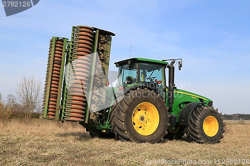 Image of John Deere 8430 Agricultural Tractor with Ring Roller by Field