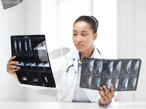 Image of african doctor looking at x-rays