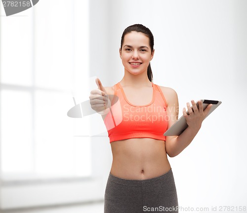 Image of sporty woman with tablet pc computer