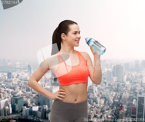 Image of sporty woman with water bottle