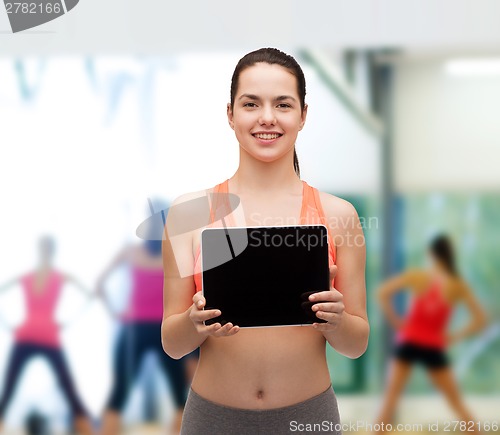 Image of sporty woman with tablet pc blank screen