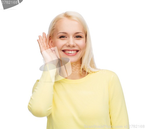 Image of smiling young woman listening to gossip