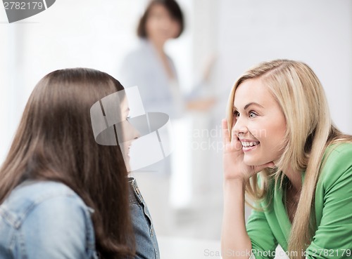 Image of student girls gossiping at school