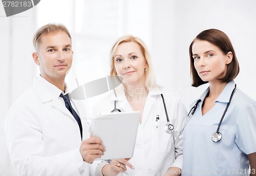 Image of doctors looking at tablet pc