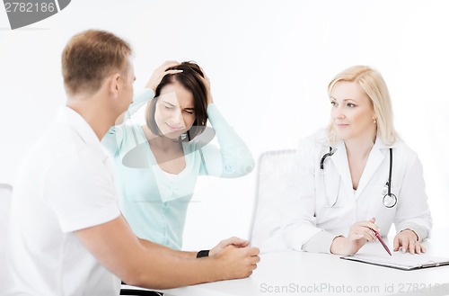 Image of doctor with patients in hospital