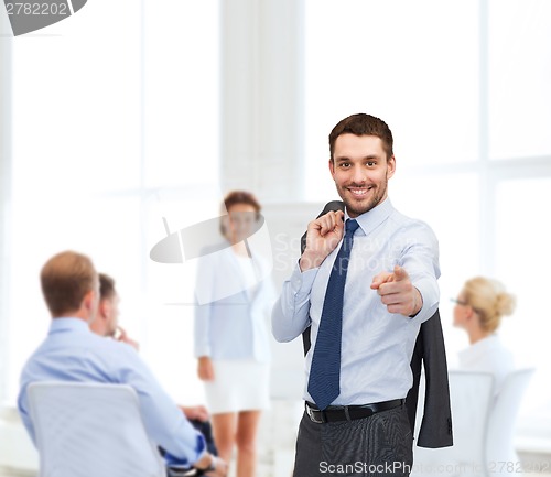 Image of handsome buisnessman with jacket over shoulder