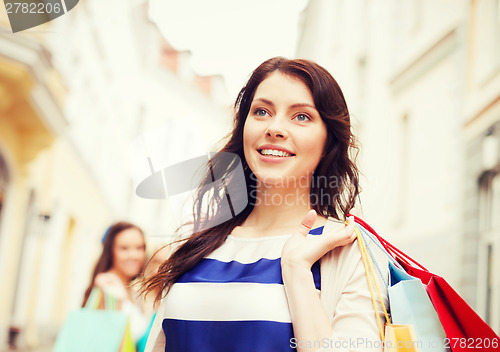 Image of woman with shopping bags in ctiy