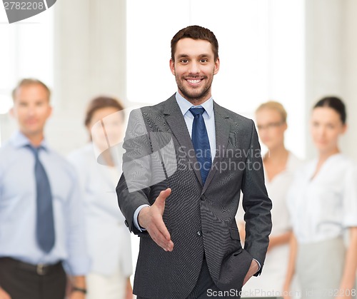 Image of businessman with open hand ready for handshake