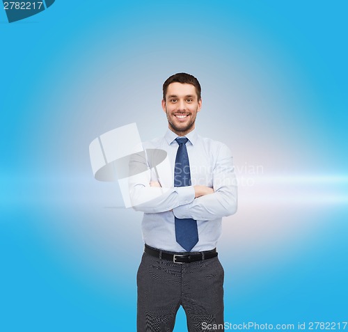 Image of handsome businessman with crossed arms