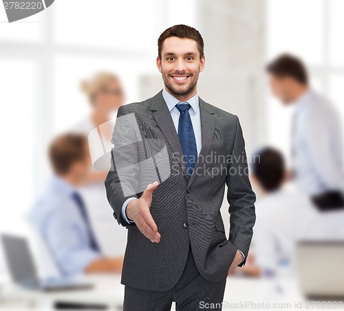 Image of businessman with open hand ready for handshake