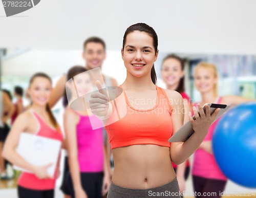 Image of sporty woman with tablet pc computer
