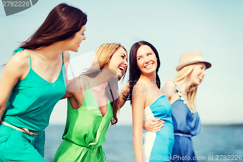 Image of girls walking on the beach