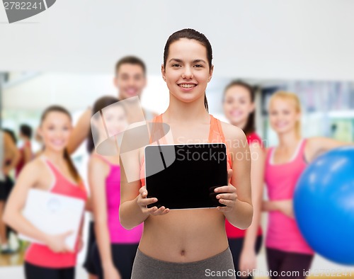 Image of sporty woman with tablet pc blank screen