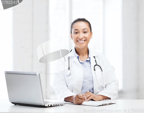 Image of female doctor with laptop pc