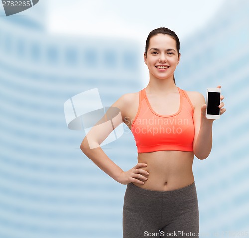 Image of sporty woman with smartphone