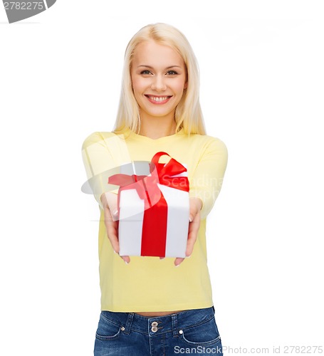 Image of smiling girl with gift box