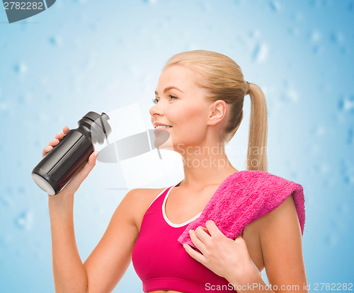 Image of sporty woman with special sportsman bottle