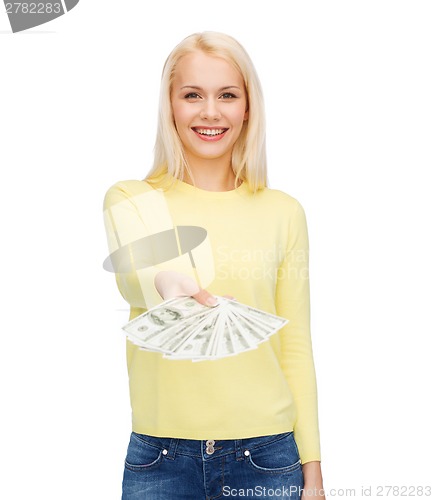 Image of smiling girl with dollar cash money