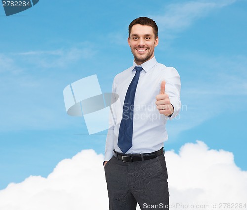 Image of handsome businessman showing thumbs up