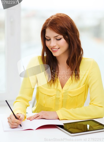 Image of student with tablet pc computer and notebook