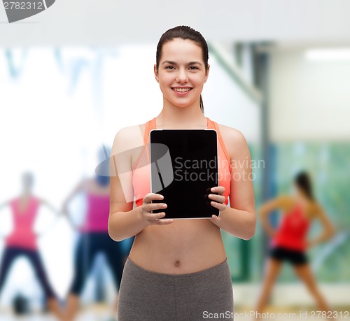 Image of sporty woman with tablet pc blank screen