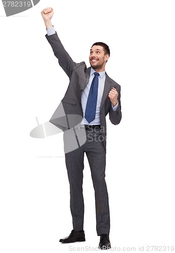 Image of happy businessman with hands up