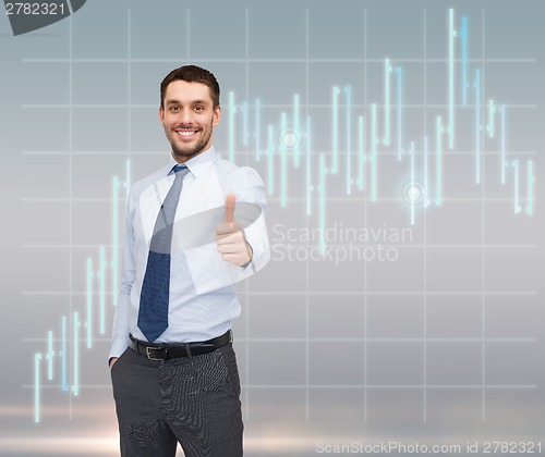 Image of handsome businessman showing thumbs up