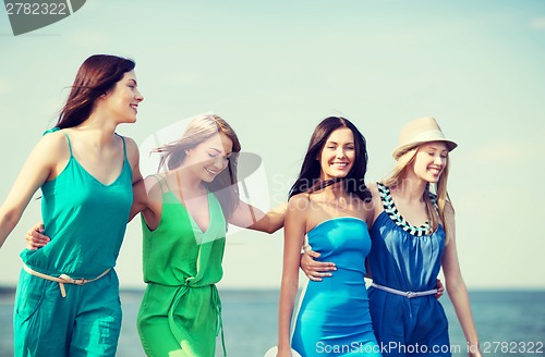 Image of girls walking on the beach