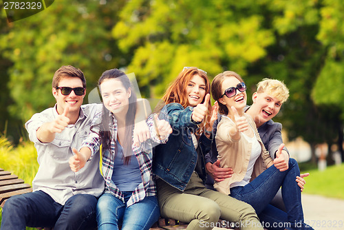 Image of group of students or teenagers showing thumbs up