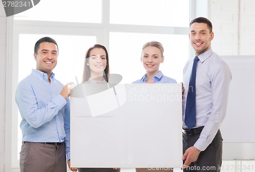 Image of business team in office with white blank board