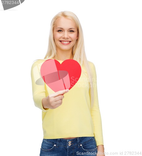 Image of smiling woman with red heart