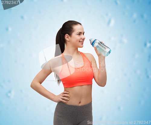 Image of sporty woman with water bottle