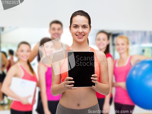 Image of sporty woman with tablet pc blank screen