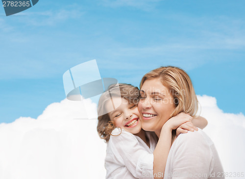 Image of happy mother and daughter hugging