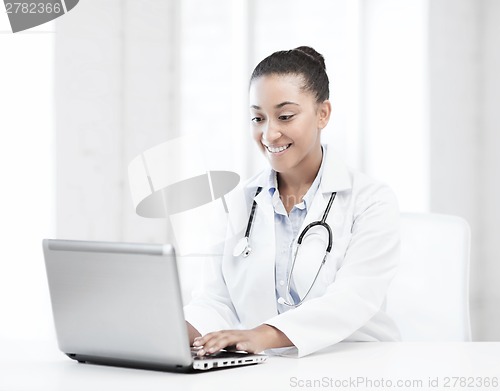 Image of female doctor with laptop pc