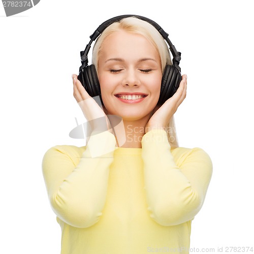 Image of smiling young woman with headphones