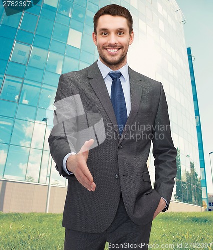 Image of businessman with open hand ready for handshake