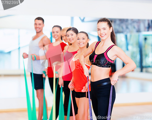 Image of group of people working out with rubber bands