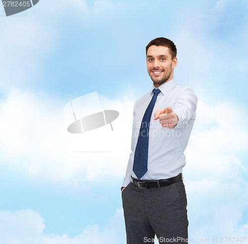 Image of handsome businessman pointing finger at you