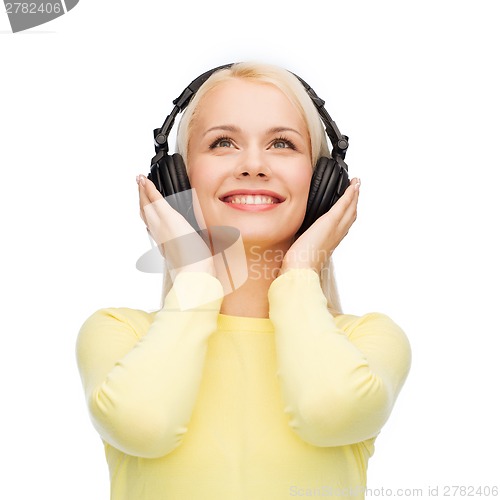 Image of smiling young woman with headphones