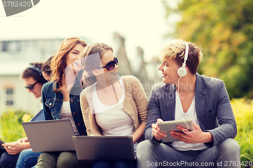 Image of students or teenagers with laptop computers