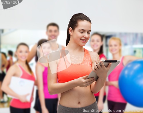 Image of sporty woman with tablet pc computer
