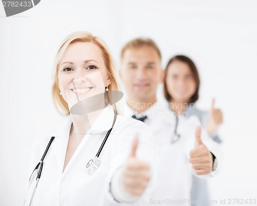 Image of team of doctors showing thumbs up