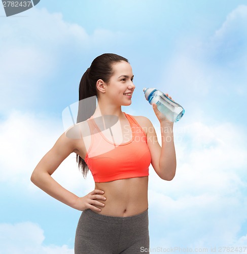 Image of sporty woman with water bottle