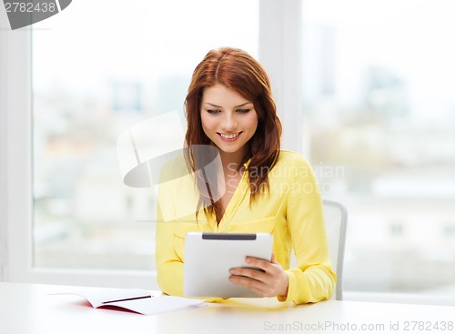 Image of student with tablet pc computer and notebook