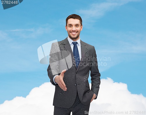 Image of businessman with open hand ready for handshake